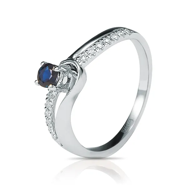 Женское кольцо из золота с бриллиантом и сапфиром